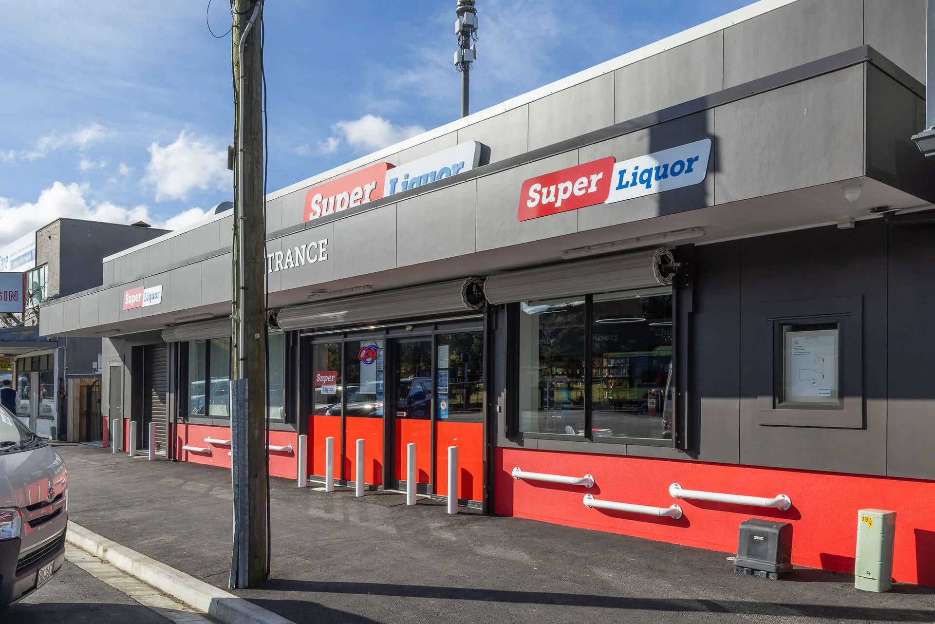 Super Liquor store frontage in red and grey after a commercial fit-out
