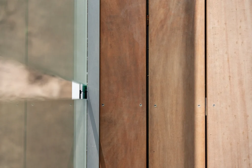 Beachfront Living Elevated - timber cladding and glass balustrade detail