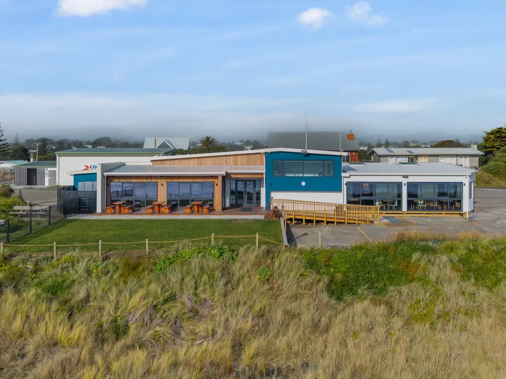 Rebuilt Waikanae Boating Club on its beachfront site, modern two-tone commercial exterior